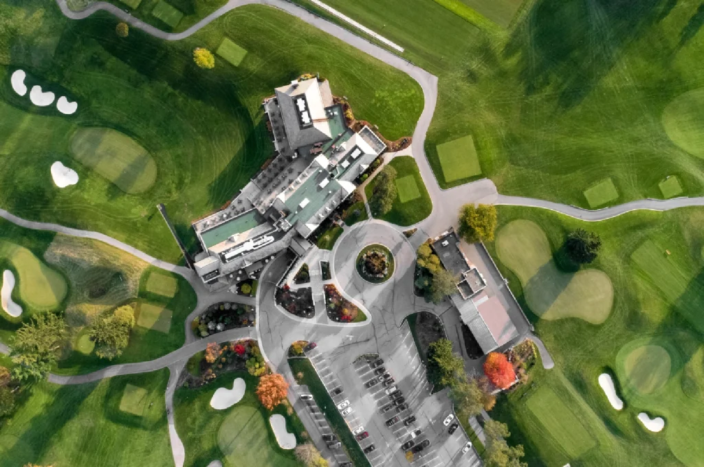 An aerial view showing the strategic routing of a golf course designed to maximize residential property frontage.