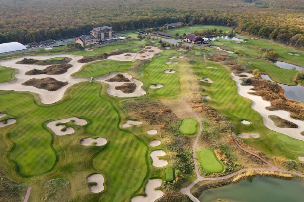 A detailed golf course architecture plan showing drainage routes and elevation contours.