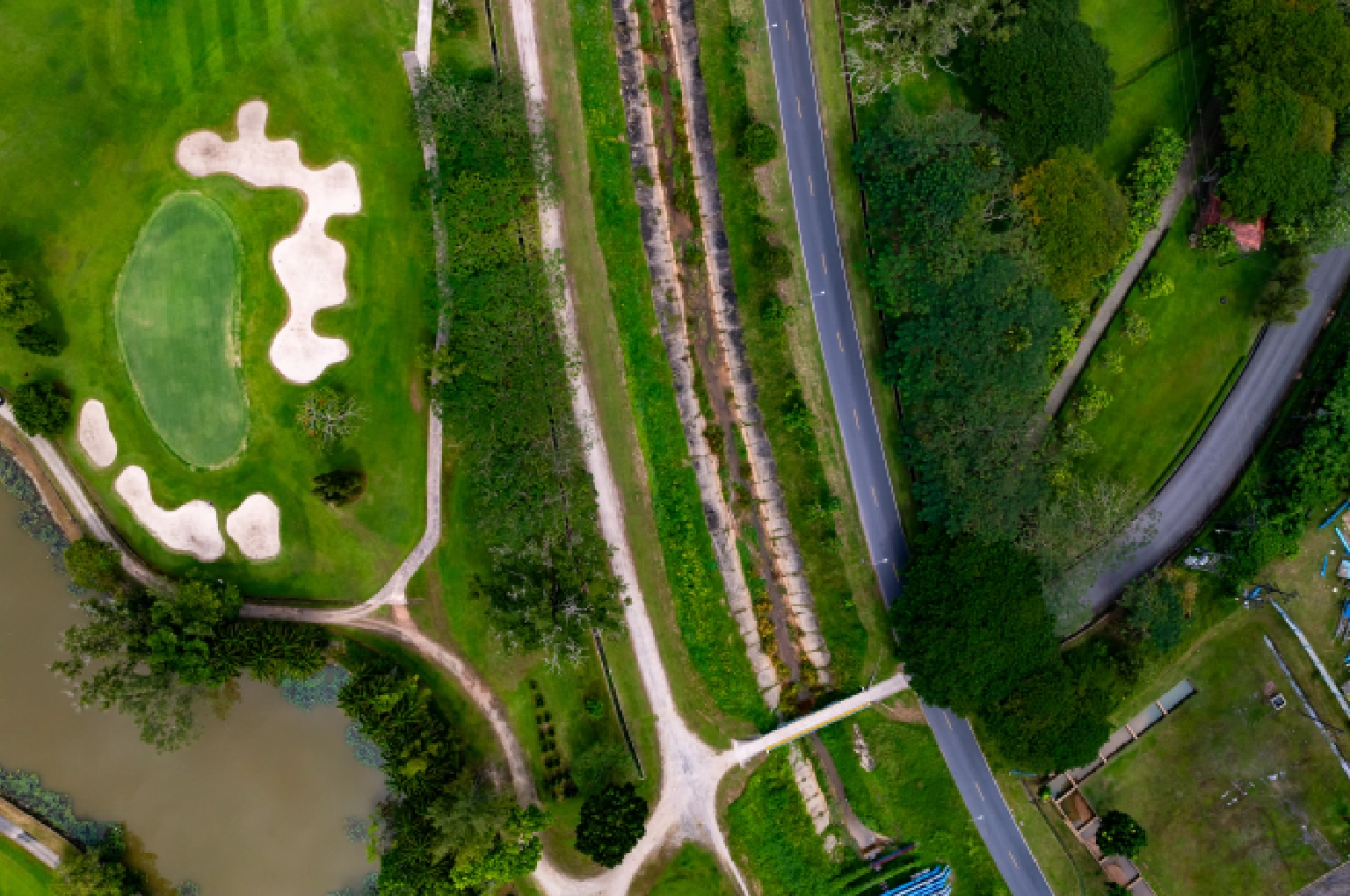 An aerial view showing the strategic routing of a golf course designed to maximize residential property frontage