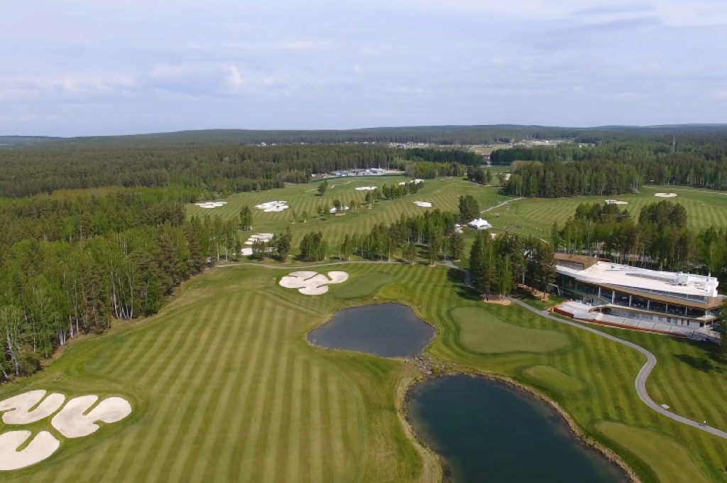 Clubhouse view overlooking a prestigious real estate golf course
