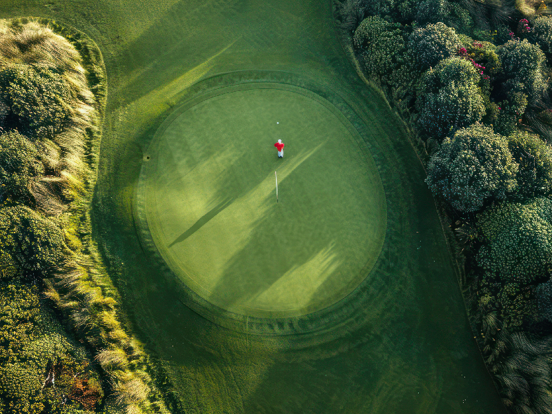 Overhead view of a strategic golf hole layout showing multiple paths to the green