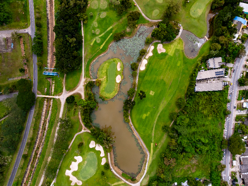 Topographical map showing natural hydrological pathways and drainage basins on a golf course site