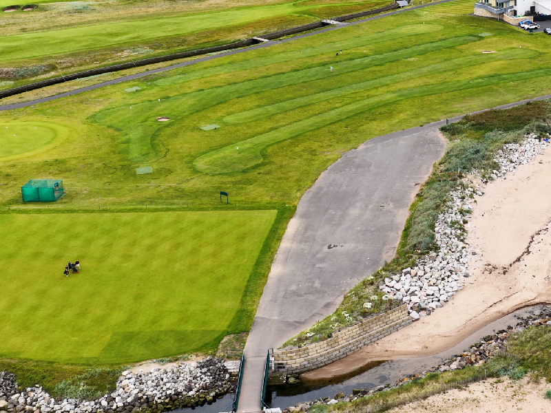 Aerial shot of a championship course showcasing natural ridges, valleys, and rocky outcrops