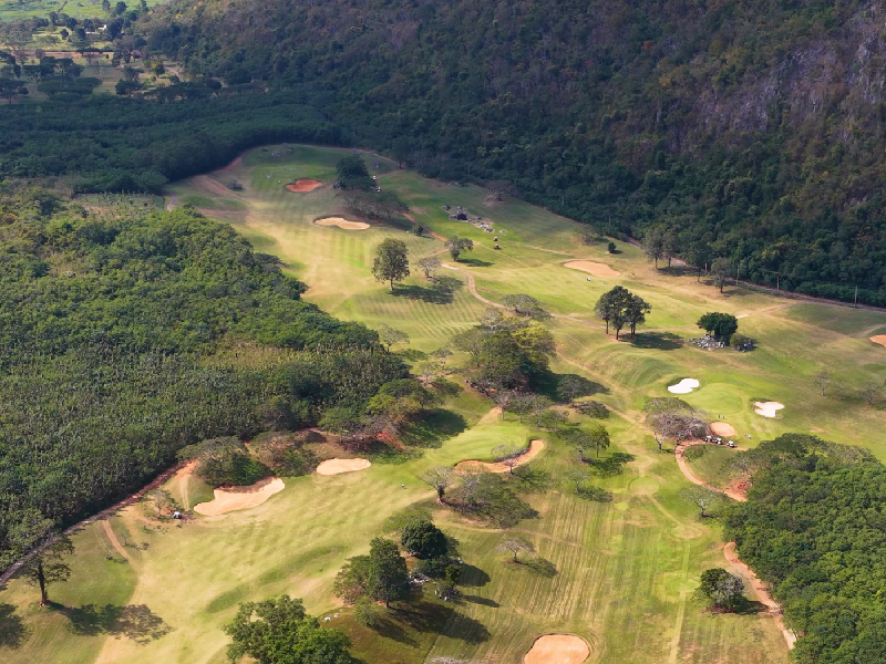 A panoramic aerial view of a championship course routing following the natural terrain for master planning excellence